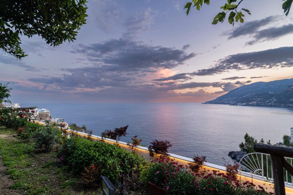 Sunset over the Amalfi Coast viewed from a garden terrace