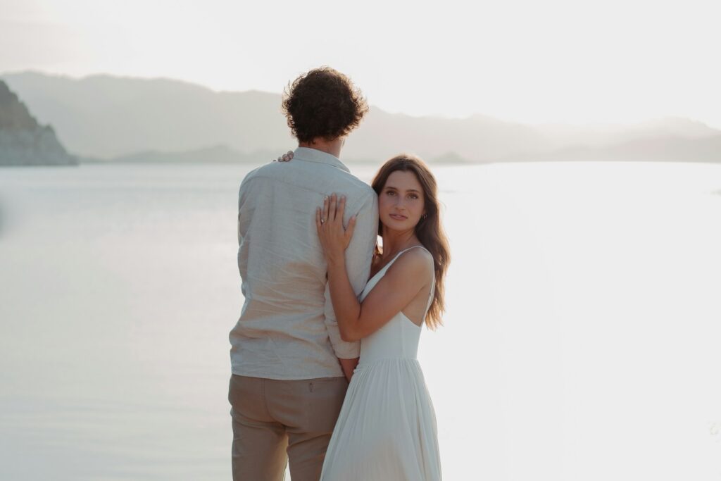 Couple posing beside the sea during an Italian dream wedding on the Amalfi Coast.
