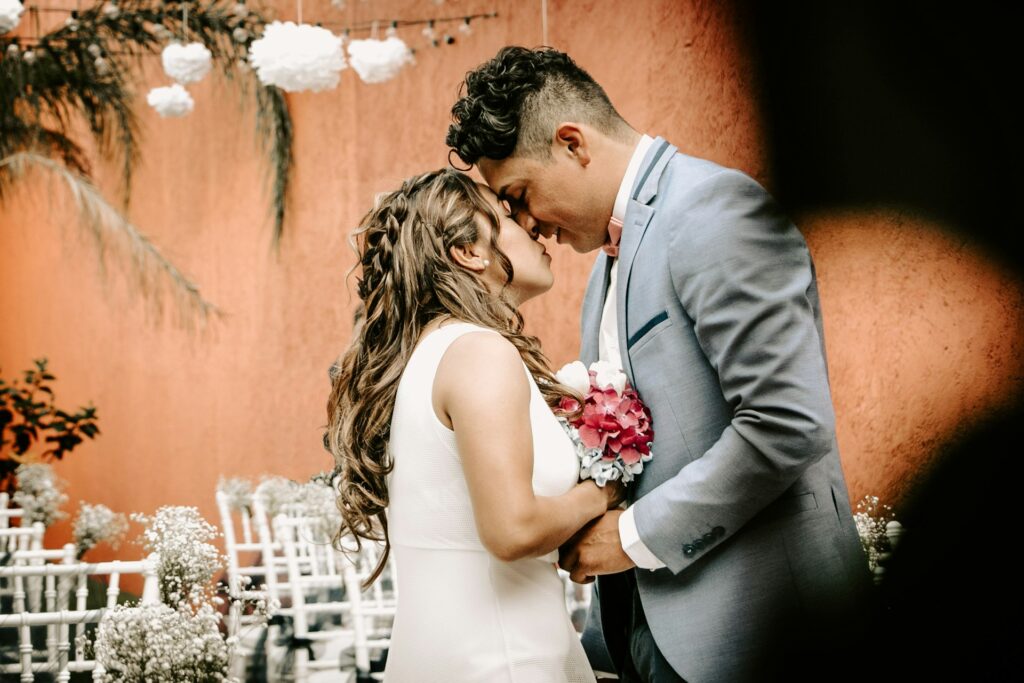 Bride and groom sharing a tender moment at an Italian dream wedding.