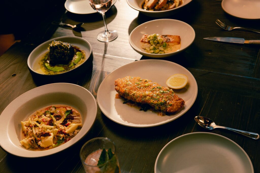 Fish and pasta dishes served with lemon as part of an Amalfi Coast late-summer meal.