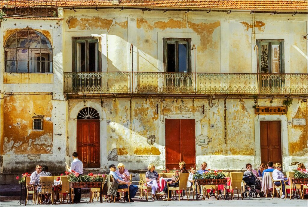 Visitors seated at an outdoor café before an evening at the Ravello Festival.